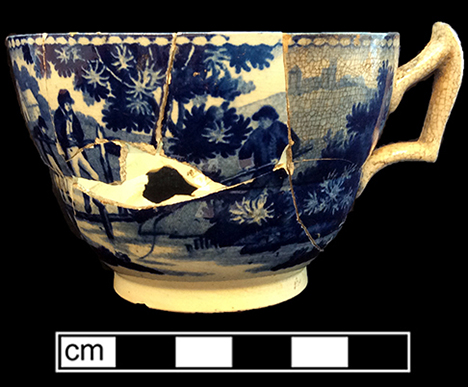 Pearlware Canova shape handled cup printed underglaze in medium blue. One of two matching cups from this assemblage. 3.5” rim diameter; 2.25” vessel height. Middle image is cup interior. Image on bottom, a plate, whose pattern is called "The Footbride," is from a private collection.